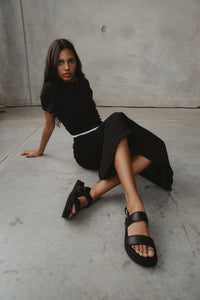 black vegan leather sandals - the dorothy, edie collective - worn by a model during shoot 1